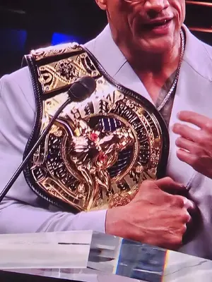 the-rocks-new-belt-shown-at-the-wrestle-mania-40-hall-of-v0-ppgoonu88ssc1.webp