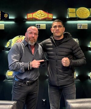 alex-pereira-alongside-triple-h-at-wwe-headquarters-v0-fyjrnbh2221f1.jpg