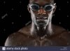 young-african-man-with-swimming-goggles-isolated-over-black-background-E9WP71.jpg