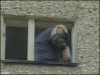 Guy sets himself on fire and jumps out of his window.gif