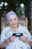 55651678-upset-grandma-with-game-joystick-playing-videogames.jpg