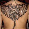 Unique-Black-Polynesian-Bat-Tattoo-On-Man-Upper-Back.jpg