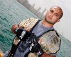 BJ-Penn-Holding-His-UFC-Champion-Belts.jpg